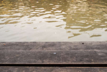 wooden over river reflectionの写真素材