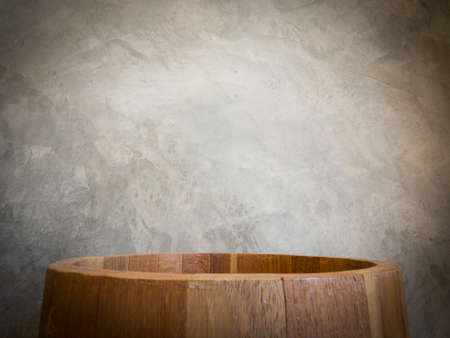 big empty wooden circle bucket over the vintage wall, loft styleの写真素材