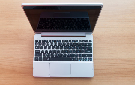 Business office desk laptop on wooden tableの写真素材