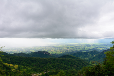 View from mountain with raining and cloudy sky, Phetchabun, Thailandの写真素材
