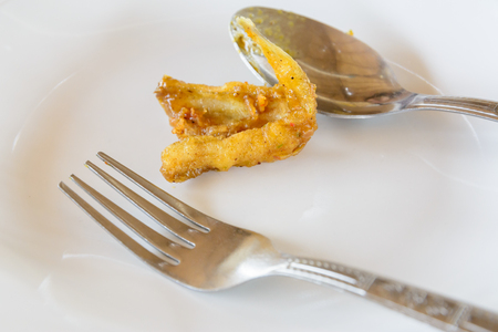 Stir Fried fish on white dish, diet conceptの写真素材