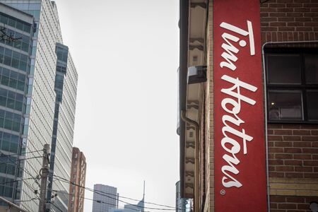 Tim Hortons Cafe logo in Downtown Toronto, Ontario, Canada. Tim Hortons is a multinational fast food restaurant based in Canada, icts Known for coffee and donutsのeditorial素材