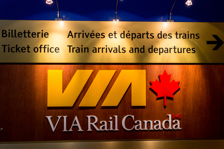 Via Rail Canada departures board in Quebec City Royal Palace rail station. Via Rail Canada is the hand rail passenger carrier in Canada.のeditorial素材