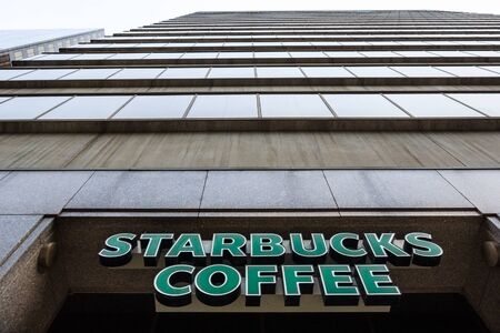 Starbucks logo in front of skyscrapers in Downtown Toronto, Ontario, Canadaのeditorial素材