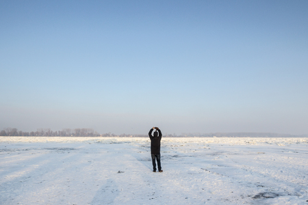 BELGRADE, SERBIA - JANUARY 21, 2016: People walking on to the frozen Danube, due to year exceptionnaly cold weather over the Balkans lasting for more than 10 daysのeditorial素材