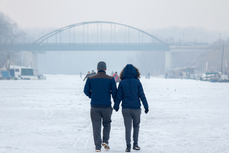 PANCEVO, SERBIA - JANUARY 22, 2017: People walking on the frozen river Tamis - Timis (a Danube tributary) due to year exceptionnaly cold weather over the Balkans lasting for more than 10 daysのeditorial素材