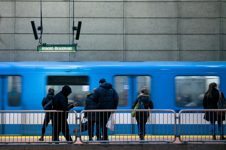 MONTREAL, CANADA - DECEMBER 29, 2016: People waiting for a Metro station in Lionel Groulx