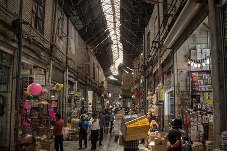 Picturesque photo of Tehran bazaar with warm colors and iranians walking.のeditorial素材