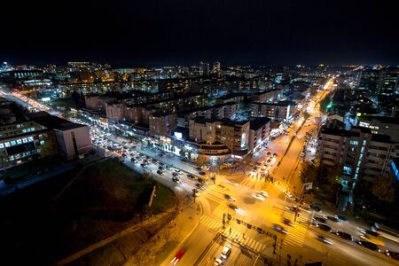 Night view of the crossroad between Bill Clinton Boulevard and George W Bush Boulevard seen from the Mother Tereza Cathedral in Pristina, capital city of Kosovo.の写真素材