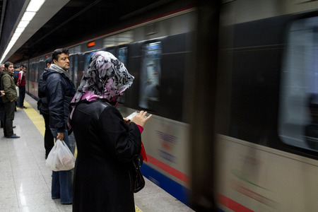 ISTANBUL, TURKEY - DECEMBER 28, 2015: People waiting to board a Marmaray train. Opened in 2013, the Marmaray rail line connects the Asian and European sides of Istanbul through a tunnel under the Bosphorus.のeditorial素材