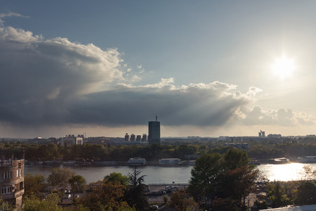 BELGRADE, SERBIA - APRIL 23, 2017: New Belgrade (Novi Beograd) at sunset, with the usce tower in front, seen from Kalemegdan parkのeditorial素材