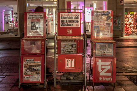 MUNICH, GERMANY - DECEMBER 17, 2017: German newspaper Bild Zeitung for sale in the streets of Munich on stands, surrounded by TV Journal and ZT. Bild Zeitung is one of the biggest tabloids of Germany

German daily newspaper Bild Zeitung for sale on a stanのeditorial素材