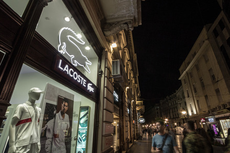 BELGRADE, SERBIA - JUNE 16, 2018: Logo of Lacoste on their main store for Belgrade. Lacoste is a French clothing company, selling clothing, footwear, eyewear, leather goods, perfume, towels and watchesのeditorial素材