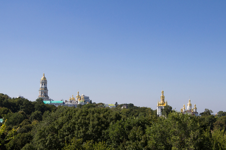 Panorama of Kiev Hills with a skyline made of the domes of Pechersk Lavra Monastery and churches, surrounded by a wood. it is one of the main landmarks of the cityの写真素材