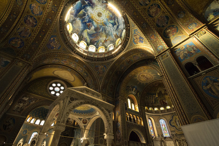 SZEGED, HUNGARY - JULY 3, 2018: interior of Szeged cathedral, with the frescoes, altar and transept....
