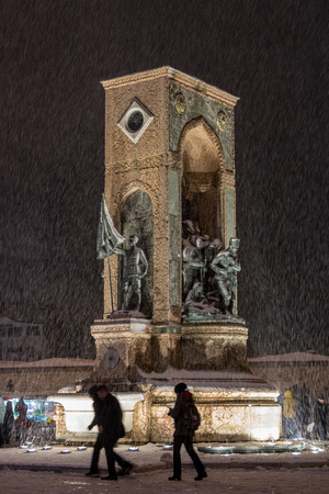 ISTANBUL, TURKEY - DECEMBER 30, 2015: Republic Monument, or Monumento Alla Republica, or Cumhuriyet Aniti, during a snow storm on Taksim Square, an italian gift to the Turkish Republic & Independence

Picture of Taksim Sqaure and Istiklal street, at nightのeditorial素材