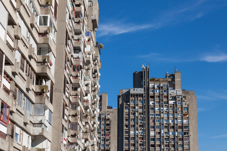 Traditionnal communist housing in the suburb of Belgrade, in New Belgrade. These kind of high rises are symbols of the brutalist architecturePicture of two socialist buildings of Novi Beograd at sunset. They are typical of the communist architectural trのeditorial素材