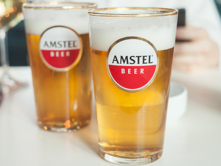 BELGRADE, SERBIA - OCTOBER 10, 2018: Logo of Amstel beer on a glasssponsored by the brand. Amstel is a Dutch light pilsner beer produced in Amsterdam, belonging to Heineken International

Picture of a beer glass bearing the logo of Amstel Beer, in a Serbiのeditorial素材