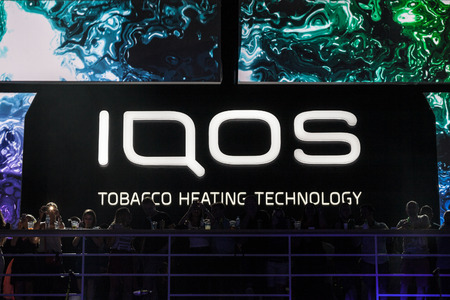 BELGRADE, SERBIA - AUGUST 16, 2018: Iqos logo in front of a bar terrace in Serbia. Iqos, beloning to Philip Morris International, is a tobacco heating cigarette system

Picture of a sign with the Iqos logo taken in front of the terrace of a summer bar Belのeditorial素材