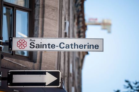 MONTREAL, CANADA - NOVEMBER 4, 2018: Street sign indicating Rue Sainte Catherine Street in Montreal, Quebec. Located in tdowntown, it is one of the most known and most active streets of the city

Picture of a standard Montreal street sign with the city loのeditorial素材