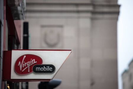 MONTREAL, CANADA - NOVEMBER 5, 2018: Virgin mobile logo on their main shop for Montreal center. Part of Richard Branson Virgin group, it's a telecommuncation and phone carrierのeditorial素材