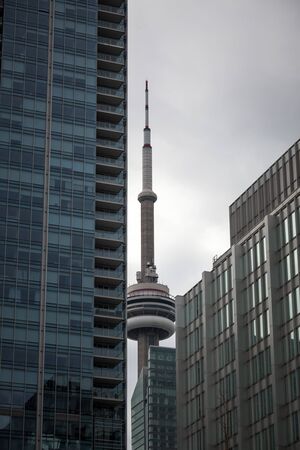 TORONTO, CANADA - NOVEMBER 13, 2018: Canadian National Tower (CN Tower) surrounded by modern skyscrapers in Toronto. CN Tower is the tallest building of the capital of Ontario, and one of landmarksのeditorial素材