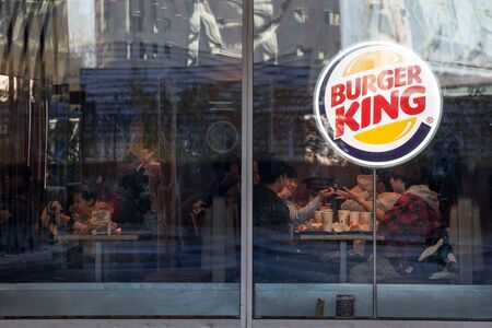 MONTREAL, CANADA - NOVEMBER 4, 2018: Burger King logo on their main fast food restaurant in Montreal, Quebec. Burger King is an american fast food restaurant brand and franchise spread worldwideのeditorial素材