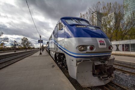 MONTREAL, CANADA - NOVEMBER 7, 2018: Allo Exo Montreal suburban train with its logo on a locomotive...
