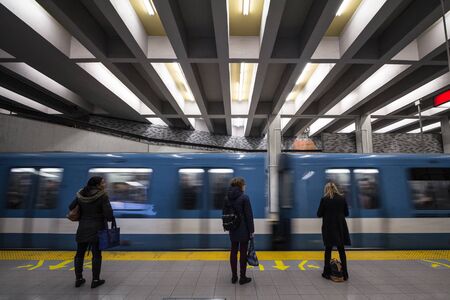 MONTREAL, CANADA - NOVEMBER 6, 2018: People waiting for a subway in Berri-UQAM station platform,...