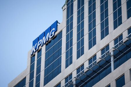 OTTAWA, CANADA - NOVEMBER 11, 2018: KPMG logo on their main office for Ottawa, Ontario, in a business district. KPMG is one of the main audit firms in the world, within the Big Four Group

Picture of KPMG logo on a skyscraper in the afternoon in Ottawa doのeditorial素材