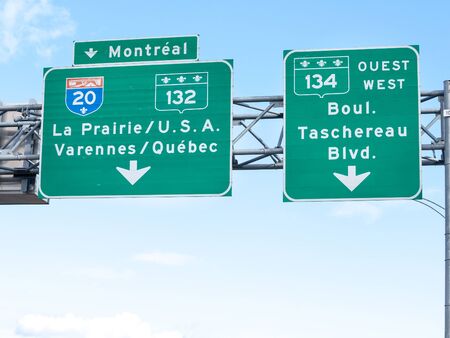 MONTREAL, CANADA - NOVEMBER 8, 2018: Highway road sign indicating the direction of Montreal and the way on the Interstate motorway to the USA Canada border with the United States of America

Picture of a roadsign taken on a Montreal highway, in Quebec, Caのeditorial素材