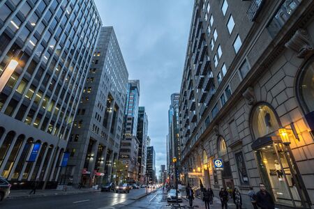MONTREAL, CANADA - NOVEMBER 7, 2018: Boulevard de Maisonneuve street in downtown Centre Business District of montreal with pedestrians passing by at night, in Montreal, Quebec

picture of Maisonneuve street, in Montreal, Quebec, Canada, with people walkinのeditorial素材