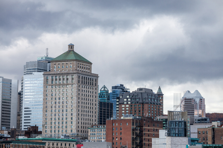 Montreal skyline, with the iconic buildings of the old Montreal (Vieux Montreal) and the CBD business skyscrapers taken from the port.の写真素材