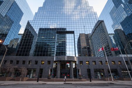 OTTAWA, CANADA - NOVEMBER 10, 2018: Constitution Square entrance in the CBD near buildings of the Ottawa skyline, towers and skyscrapers for Office space. Ottawa is a major hub for business in AmericaPicture of Ottawa CDB, with a person passing in frontのeditorial素材