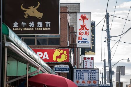 TORONTO, CANADA - NOVEMBER 13, 2018: Signs of Chinese and Asian shops taken in the Toronto chinatown, in Ontario. it is the Chinese ethnic district of the biggest canadian cityPicture of the signs of shops and restaurants of the Toronto Chinatown, both のeditorial素材