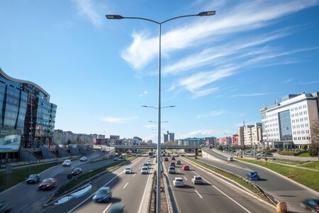 BELGRADE, SERBIA - APRIL 2, 2018: Cars passing by on the Motorway going through Belgrade, Novi Beograd, during rush hour. It is one of the main expressways of the capital city of SerbiaPicture of a crowd of cars using the main Motorway of Belgrade durinのeditorial素材