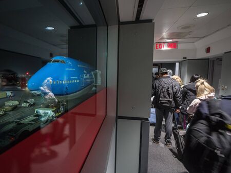 TORONTO, CANADA - NOVEMBER 15, 2018: Passengers boarding a Boeing 747-400 Jumbo jet From KLM Dutch...