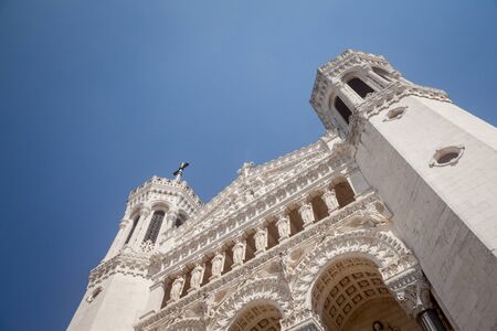 Main Facade of Basilique Notre Dame de Fourviere Basilica church in Lyon, France, during a sunny afternoon. It is a Catholic minor basilica and a major landmark of Lyonの写真素材