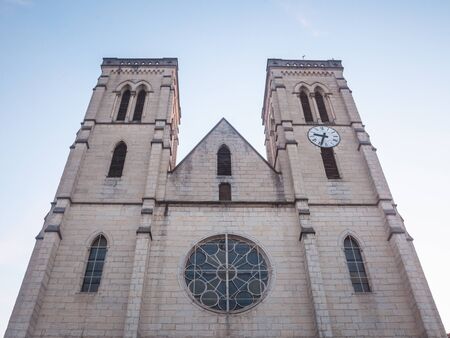 Eglise Saint Jean Baptiste Church at dusk in Bourgoin Jallieu, France, a city of Dauphine region, in Isere Departement. It is the main catholic church of this city, built in the 19th centuryの写真素材