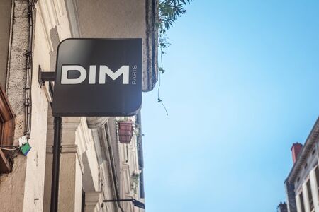 LYON, FRANCE - JULY 19, 2019: Dim logo on their main store in Lyon. Dim lingerieis an French fashion clothing retail brand  specialized in underwear

Picture of a Dim sign on their store in Lyon, France. Dim is a French company in the textile industry. Foのeditorial素材