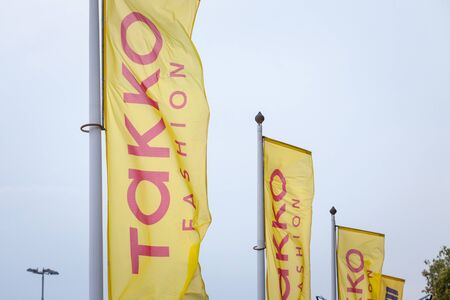 PANCEVO, SERBIA - SEPTEMBER 7, 2019: Takko Fashion logo on a flag in front of their local store. Takko is a German Fashion retailer specialized in discount clothing

Picture of a flag with the logo of Takko Fashion taken in Pancevo, Serbia, in front of thのeditorial素材
