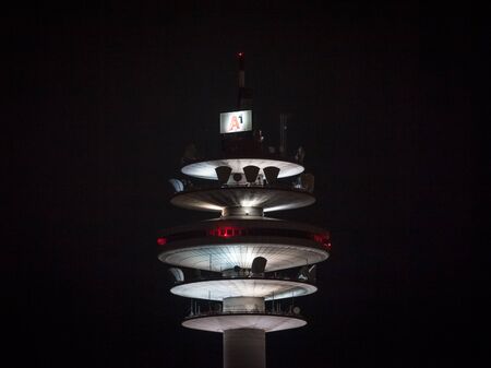 VIENNA, AUSTRIA - NOVEMBER 6, 2019: Top of the Arsenalturm during the evening with logo of A1 Telekom. Also called funkturm wien arsenal, or Arsenal tower, is a telecommunications & transmission tower.

Picture of the Arsenalturm or Arsenal tower, at nighのeditorial素材