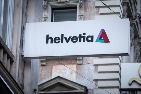 VIENNA, AUSTRIA - NOVEMBER 6, 2019: Helvetia Insurance logo in front of their office for Vienna. Helvetia Holding is a Swiss Insurance and Financial Services corporation.Picture of a sign with the logo of Helvetia Insurance taken on their main office foのeditorial素材