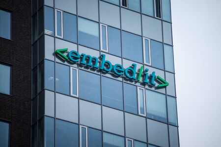 BRNO, CZECHIA - NOVEMBER 5, 2019: Embedit logo in front of their headquarters in Brno. Embed it is a Czech IT development firm specialized in financial technology for the company Home Credit.

Picture of a sign with the logo of Embed IT taken in front of のeditorial素材