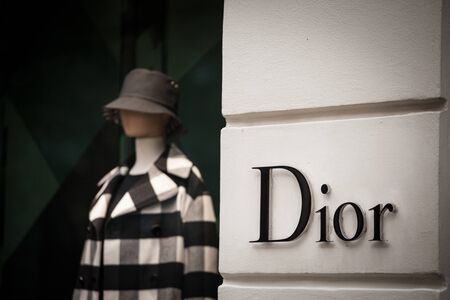 PRAGUE - CZECHIA - NOVEMBER 1, 2019:  Logo of Christian Dior seen on their Prague main boutique Dior, or CD, is a French luxury goods company specialized in perfumes and fashion.

Picture of a Dior sign on their main boutique for Prague, Czech Republic. Cのeditorial素材