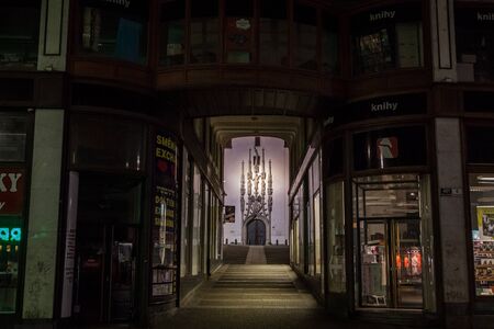 Old Town Hall of Brno, Czech republic, also called Stara Radnice, with its iconic belfry clock tower with its medieval sculptures seen from the main portal, the entrance gate to the monument.

Picture of the Stara Radnice entrande, the old city hall of Brのeditorial素材