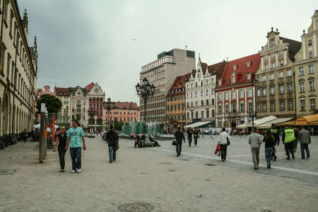 WROCLAW, POLAND - JUNE 9, 2009: Market square of Wroclaw, also called Rynek, with pedestrians...