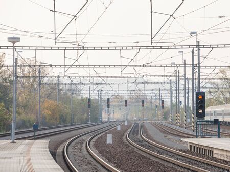 Recently reconstructed tracks on the modernized platforms of a suburban train station in a capital city of Central Europe, with brand new concrete structures signalling in the background.

Picture of a Central European train station with modernized platforms and renovated tracks. This train station is serving the suburbs of the city.の写真素材