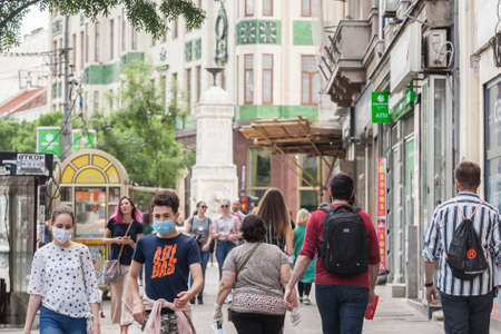 BELGRADE, SERBIA - MAY 9, 2020: Young people, a young man and a young girl, friends, walking wearing face mask protective equipment.のeditorial素材