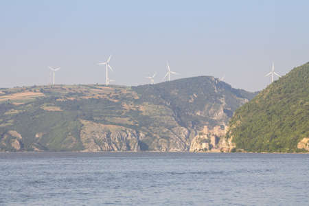 Golubac Fortress (Golubacka trvdjava, or Goluback Grad) taken during a sunny afternoon with windmills in background. The Golubac Castle was a medieval fortified town on the Danube River in Serbia. Picture of Golubac Fortress, on the Danube river, taken duのeditorial素材